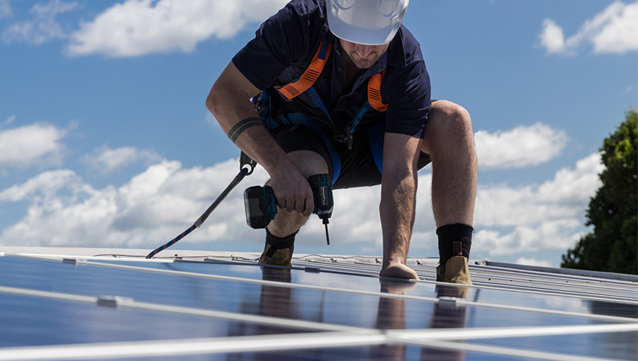 person installing solar panels 