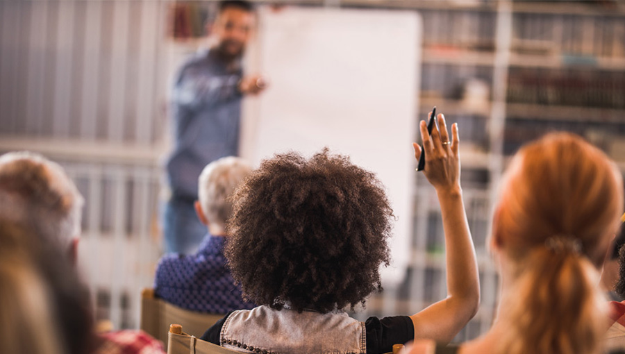 meeting with a person raising her hand