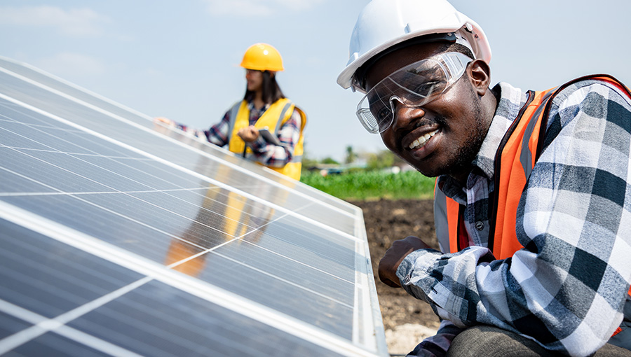 young people next to solar pv